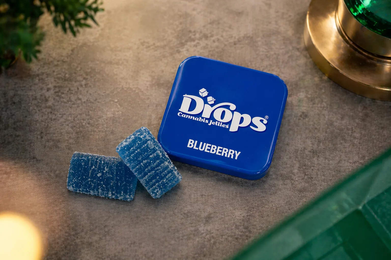 Top view of blueberry cannabis gummies and tin