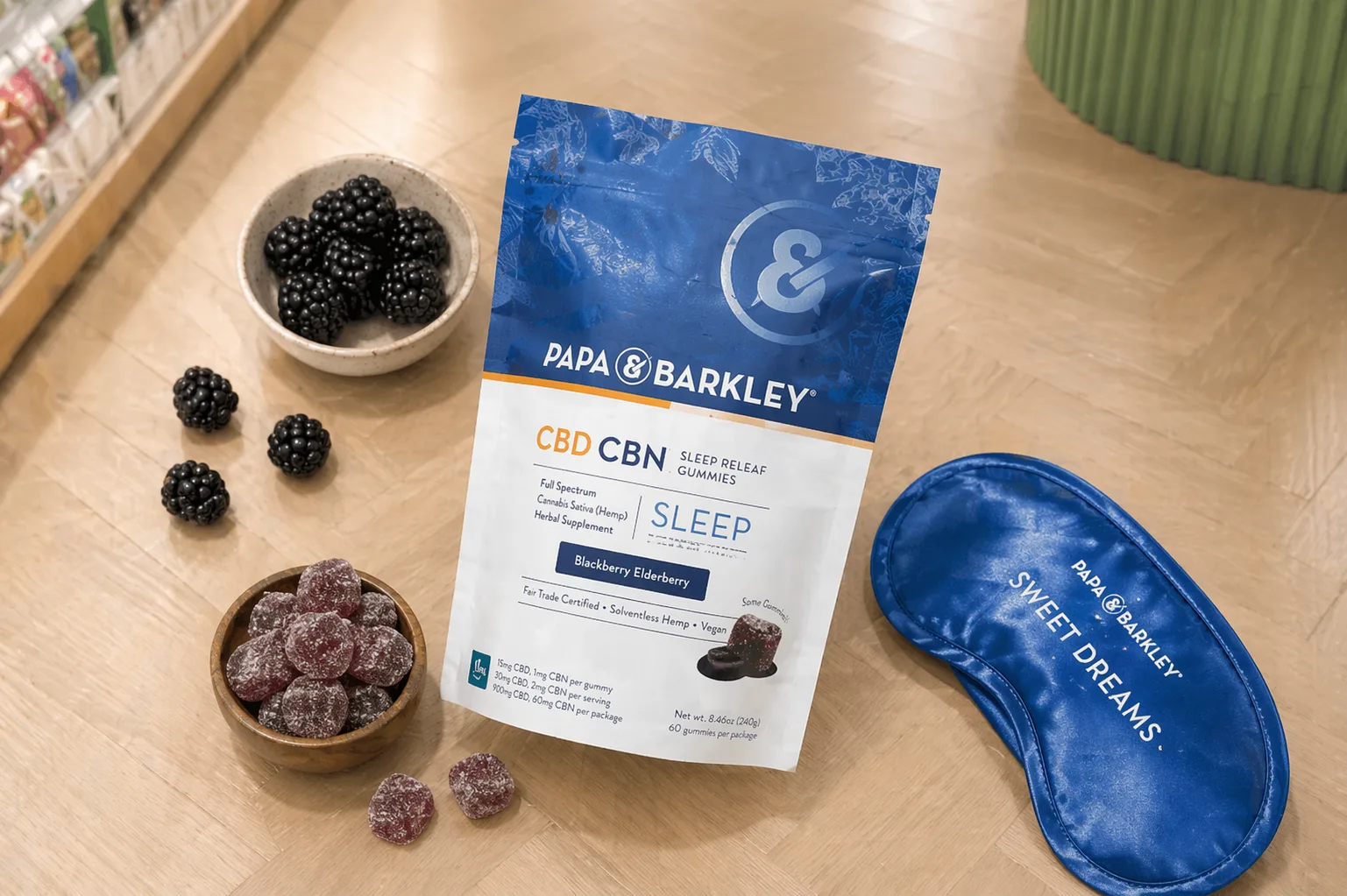 Papa and Barkley CBD CBN sleep gummies with blackberries on table