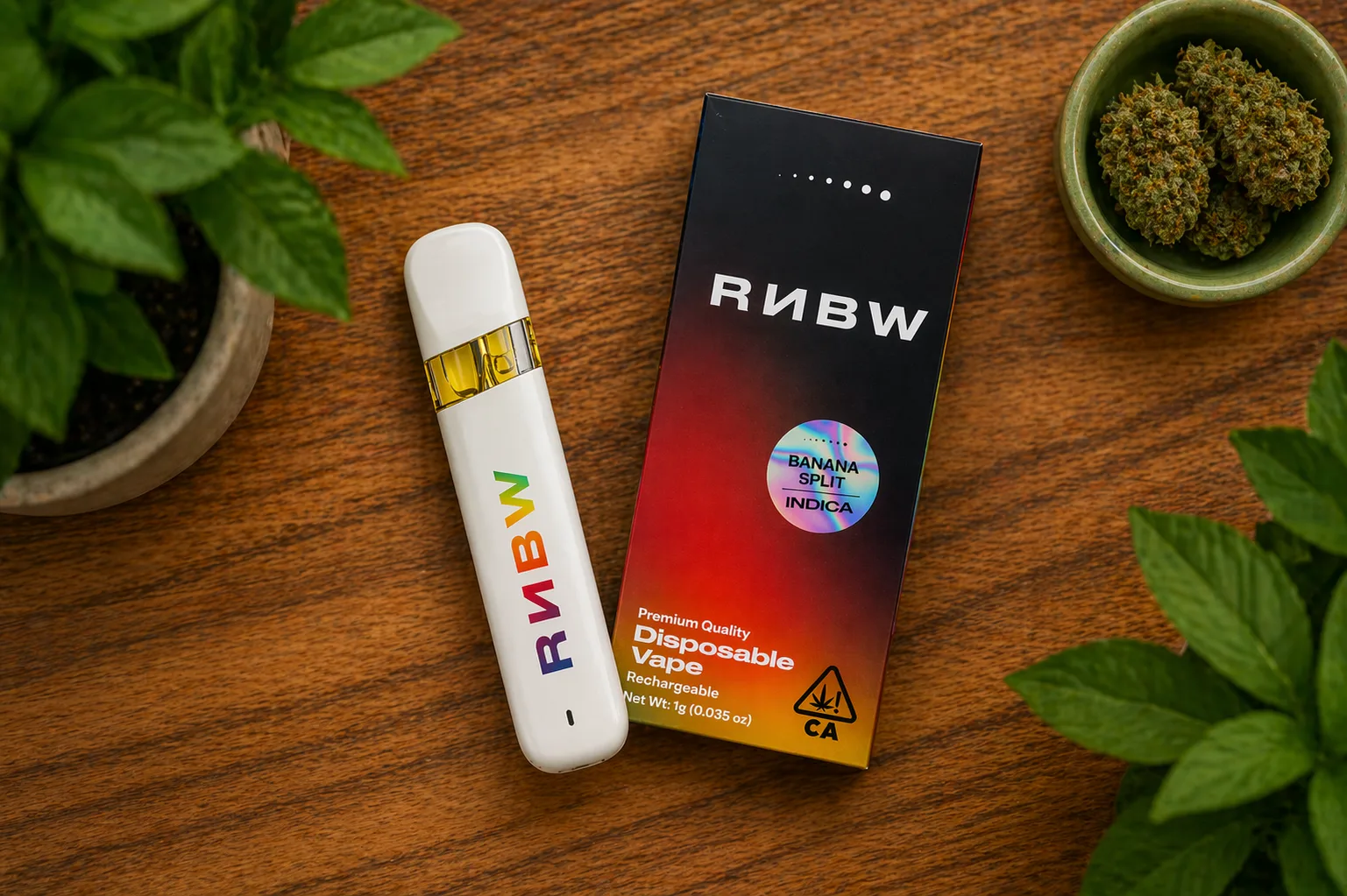 RNBW banana split disposable vape and packaging on wooden table