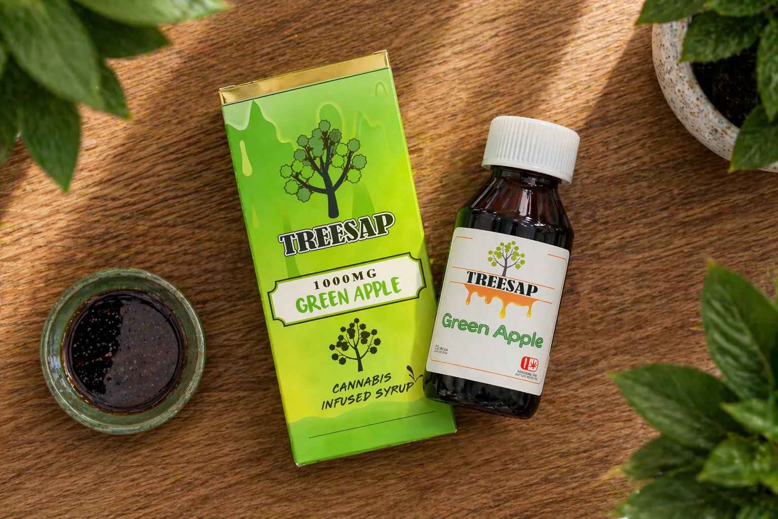 Treesap green apple cannabis syrup bottle and box on wooden table