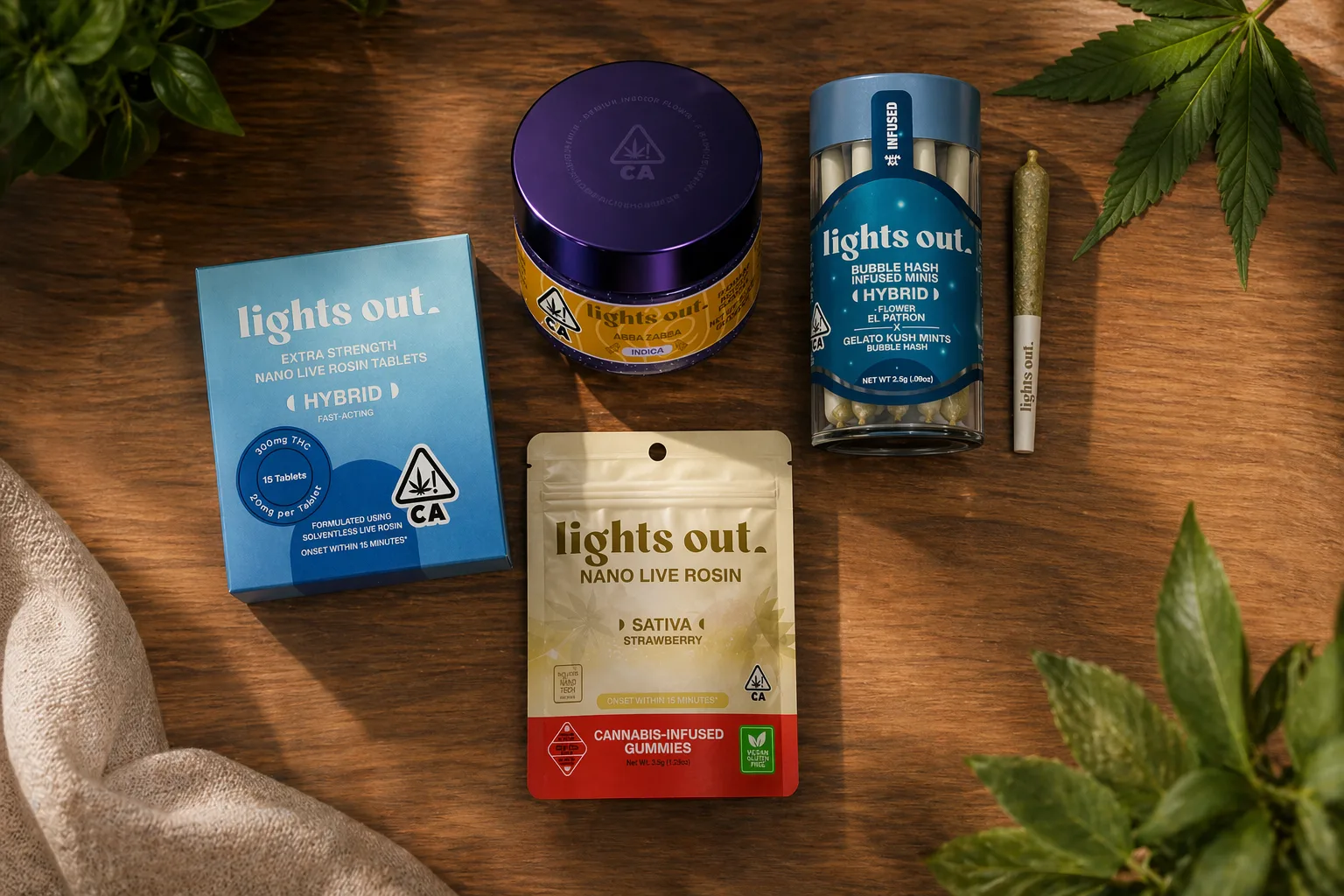 Flat lay of Lights Out cannabis tablets, flower jar, preroll, and rosin gummies