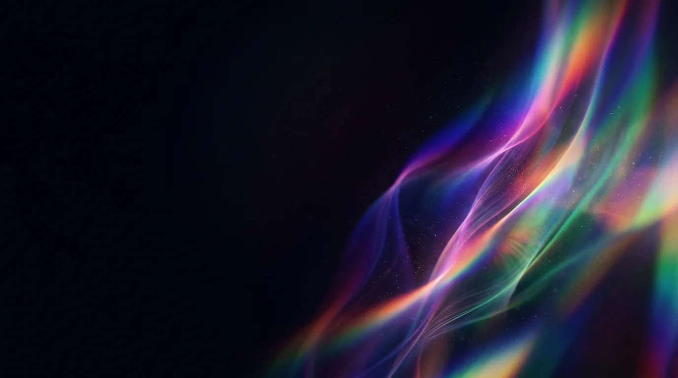 Flowing rainbow-colored light ribbons with fine sparkles across the right side of a black backdrop.